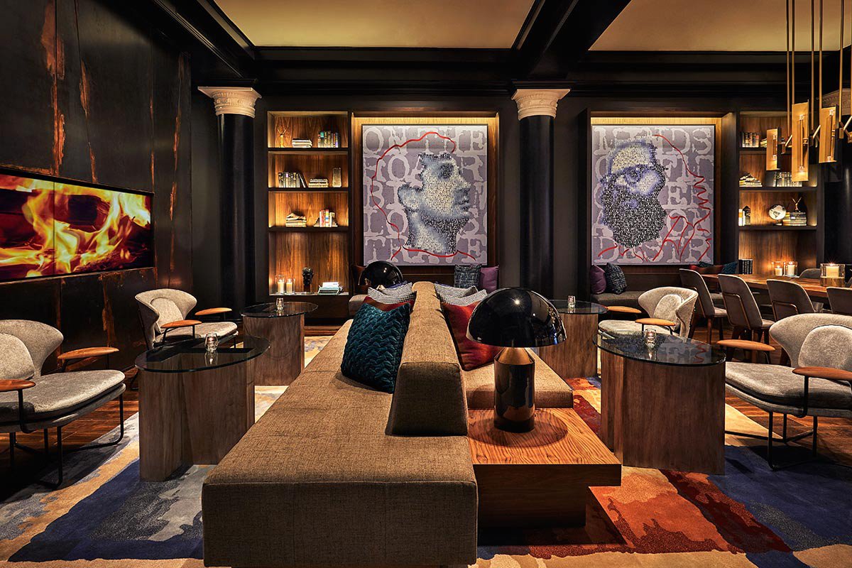 Lounge with portrait artwork at Obscenity Bar